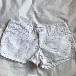 White flowered cutout shorts
